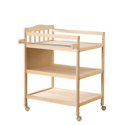 China Modern Massage Bath Integrated Multifunctional Baby Changing Crib Table Newborn Baby Care Solid Wood Table for sale