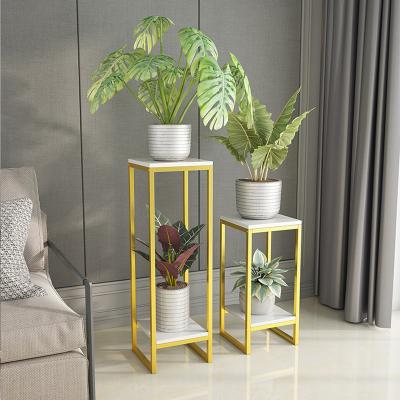 China Nordic simple radish floor-to-ceiling indoor green flower stand balcony iron flower pot shelf Europe living room balcony for sale