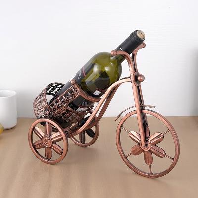 China Creative home wine rack European tricycle art iron storage vintage wine bottle storage rack for sale