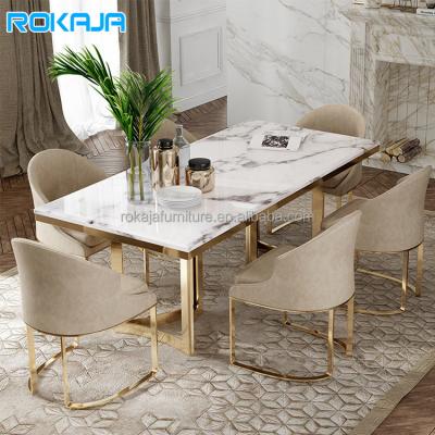 China (Other)Adjustable Luxury Dining Table Set 6 8 Seat Dining Table Gold Metal Marble Top Legs Sintered Stone Customized Dining Sets for sale