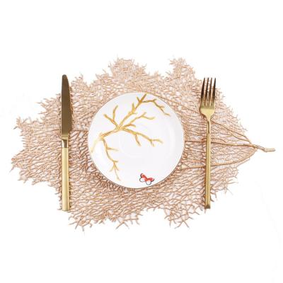 China Dining Table Decoration Coral Leaf Shaped PVC Sustainable Place Mat for sale