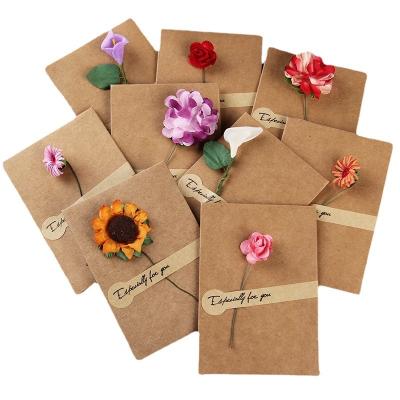 China Luxury Greeting Gard Creative Retro Kraft Paper Dried Flowers Blessing Message Card Wholesale Birthday Tanabata Teacher Christmas for sale