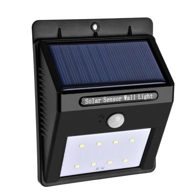 China Outdoor IP65 Tempered Glass Garden 8 LED Motion Sensor Wall Light Solar Panel Powered Lamp Barrier LED Wall Light with Sensors for sale