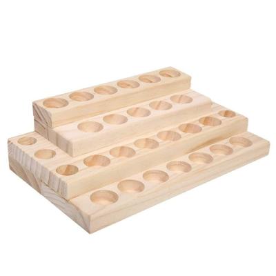 China Viet Nam Tabletop Freestanding 4 Tiers 28 Holes Bottles Solid Wooden Box For Essential Oils Bambu for sale