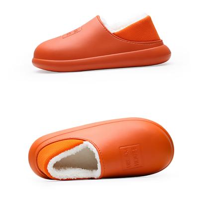 China Custom fashion trend uniseason deboss logo women plush cheap house slippers for sale