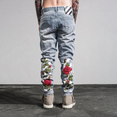 China HUNTW QUICK DRY European and American men's jeans brand fashion jeans straight embroidery ripped jeans for sale