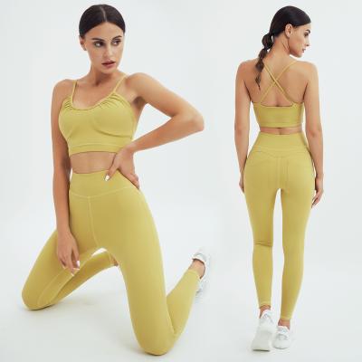 China Breathable Backless Bra High Waist Leggings With Pocket Yoga Set for sale