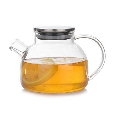 China Sustainable Hand Blown Glass Heat Resistant Teapot With Strainer Electric Stove Safe for sale