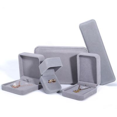 China Custom Luxury Velvet Ribbon Jewelry Storage Box Ring Gift Boxes Packaging Softly Jewelry Package Velvet Jewelry Necklace for sale