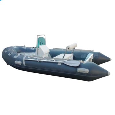 China Fishing Rigid Fiberglass Rib Inflatable Boat With Outboard Engine for sale