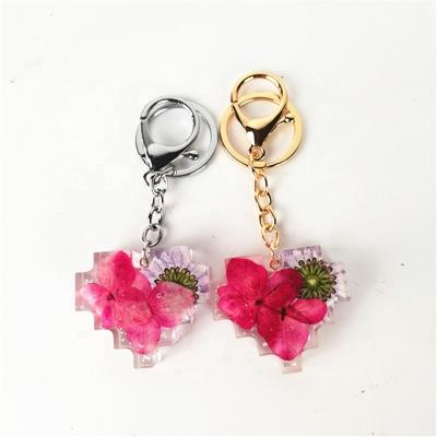 China Wholesale Fashionable Different English Transparent Custom Flower Alphabet Design 26 Clear Acrylic Epoxy Keychains for sale