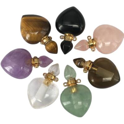 China Wholesale Custom Hand Carving Natural Crystal Essential Pendant Necklace Fluorite Perfume Bottle Heart Quartz Cosmetic Bottle for sale