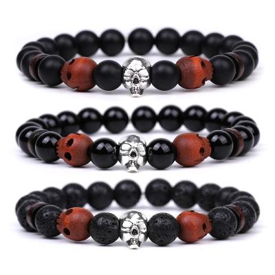 China Europe Woodworking Carving Skulls Bracelet Bead Turquoise Lava Stone Black Magnet Crystal Hand String For Man for sale