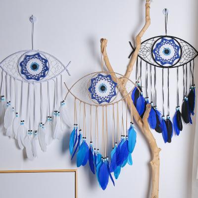 China Art Wholesale Blue Dreamy Evil Eye Catcher Feather Wall Art DIY Home Decor Good Luck Charm Folk Dreamy Handmade Macrame Catchers Large for sale