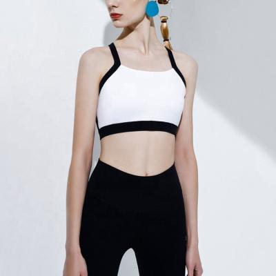 China Breathable Fashionable Sexy Backless Fitness Suit Bra Trend Bands Black And White Yoga Set For Ladies for sale