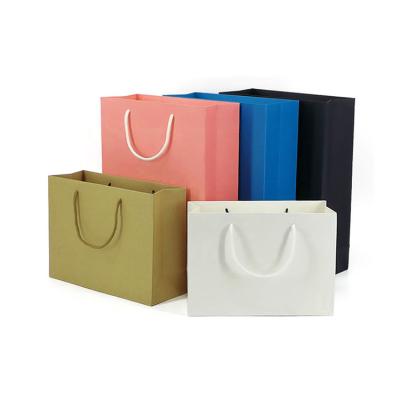 China 2022 Handmade Hot Sale Handbag Shape Colorful Printed Paper Gift Bags With Custom Logo for sale