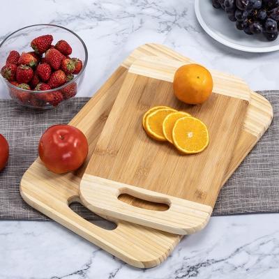 China Sustainable small mini bamboo food cutting board with a handle for sale