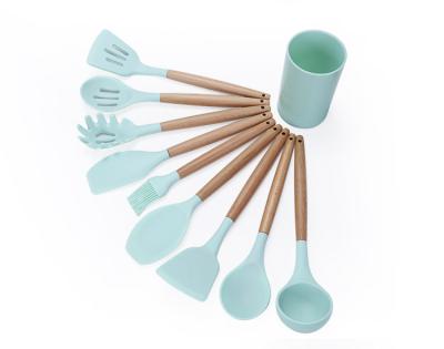 China Sustainable 9 Pcs Silicone Kitchenware Utensil Set With Plastic Cup Holder for sale