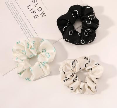 China Yiwu Charon factory Yiwu Charon Smiley Silk Scrunchie Korea Fashion Fashionable Printed LOGO Elastic Hair Scrunchies Custom Printed Bands for sale