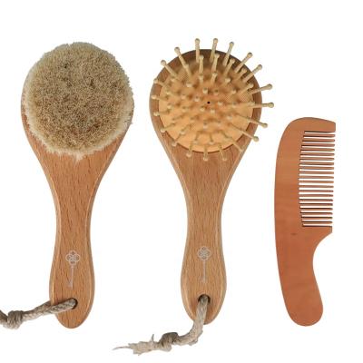 China Custom Logo Natural Beech Wooden Hairbrush cushion with soft goat stiffens round baby hair brush and comb set for newborn for sale