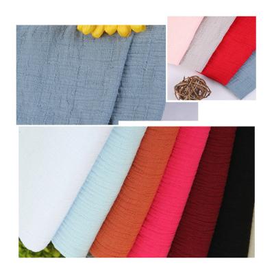 China 100%cotton fabric breathable double layer jacquard fabric crepe wicking dobby good quality solid dye for women dress for sale