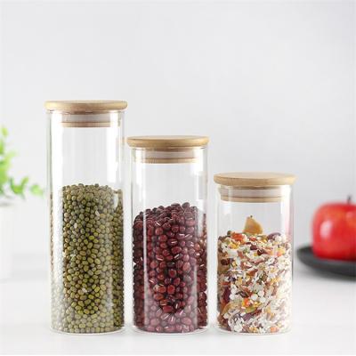 China Customized Wide Mouth High Borosilicate Glass Stocked Storage Jar With Bamboo Lid for sale