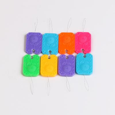 China Sunflower Plastic Multifunctional Automatic Square Needle Color Threader Plastic Threader Sewing Tool for sale