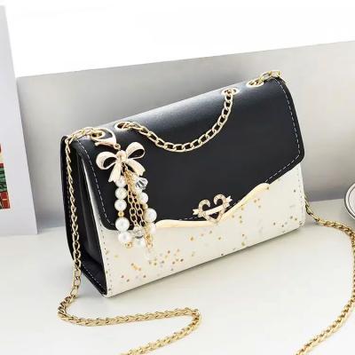 China Waterproof Wholesale Golden Chain Strap Ladies Designer Bags Bowknot-decoration Crossbody Messenger Girls Fashion Confetti Purse Handbags for sale