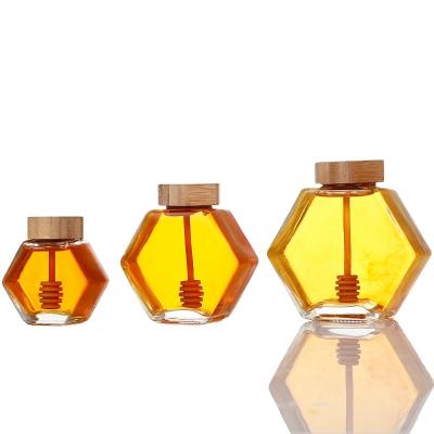 China Food Storage 220Ml 380Ml Honey Glass Jar Hexagonal Honey Glass Jar With Bee Mini Honey Dipper Pot for sale