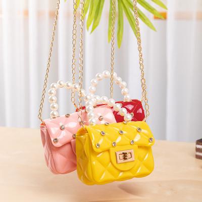 China 2022 New Red Black Kids Jelly Purses Diamond Pvc Crossbody Mini Small Pearl Handle Handbag 2022 Fashion for sale