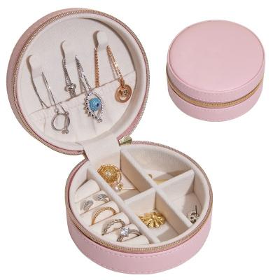 China Portable Round Leather Travel Jewelry Box Earring Stud Jewelry Zipper Storage Box for sale