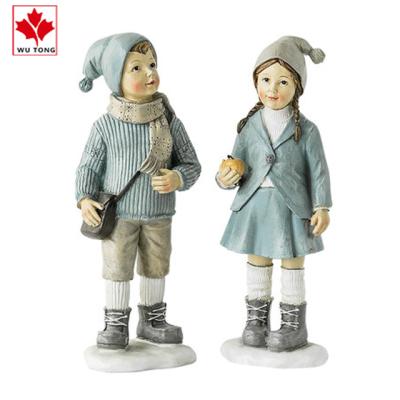 China Beautiful Artificial Polyresin Gift Boy And Girl Figures For Christmas Decor for sale