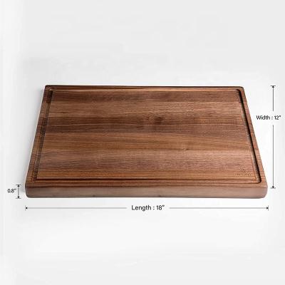 China Sustainable Wholesale Wooden Rectangle Black Walnut Cutting Board With Juice Groove for sale