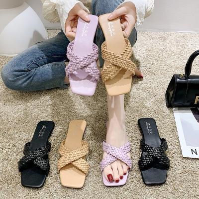 China 2021 fashion trend designer cheap PU Leather Braided Flat sandals for women and ladies luxury fashion woven summer beach sandals for sale