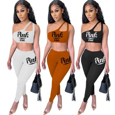 China Drop Shipping Summer New Arrivals Anti-pilling Fashion Women Clothing Letter Printed One Shoulder Pink Irregular Sports Two Piece Set for sale