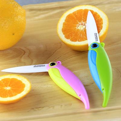 China Colorful Handle Ceramic Parrot Mini Knives Pocket Folding Fruit Knife With Safety Sheath for sale