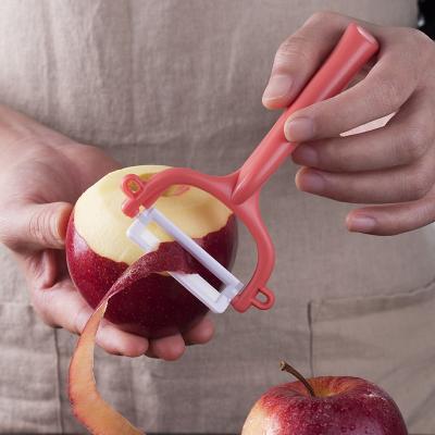 Китай Эргономичный черный рукоятка керамический кухонный пилинг для продвижения и фруктовых и овощных инструментов продается