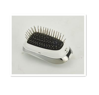 China Anti-StaticHead Battery Powered Portable Massage Comb Electric Ionic Hair Brush for sale