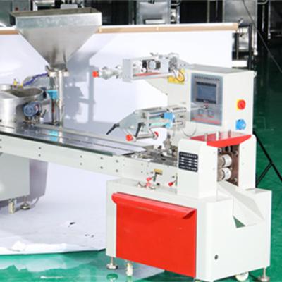 China Beverage Packing Machine Newest Line Packing Candy Packing Machine / Candy Pillow + Material Tray for sale