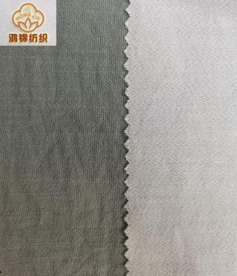 China New Trend 100% Organic Polyester Plain Dyed Solids Soft Hand Feeling High Quality Stock Fabric for sale