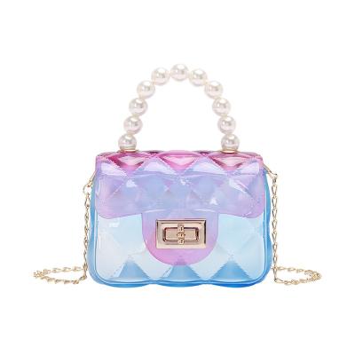 China Transparent Water Proof Candy Colors PVC Pearl Handbag Chain Shoulder Girls Clip Child Jelly Bag Mini Jelly Purse Women Tote Bag for sale