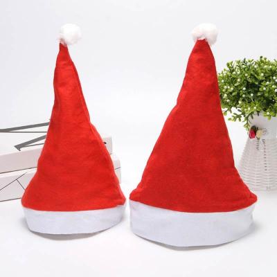 China Yiwu Nonwoven Santa Hats Large Stock Nonwoven Christmas Cheap Hats Fashion Christmas Santa Hats for sale