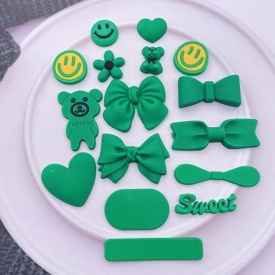 China New Environmentally Friendly Green Soft Rubber Grass Props Love Heart Smiley Bear Bow Green Flower Peach Resin Props Wholesale for sale