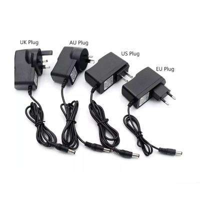 China Universal ABS 5V 12V 24V 1A 2A 3A US/UK/EU/AU DC Adapter US/UK/EU/AU Plug Power Adapter Charger Supply For Led Strip Lamp Light Driver for sale