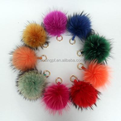 China Durable Chinese wholesale raccoon fur ball pom poms factory Christmas gift main chain handbag accessories for sale