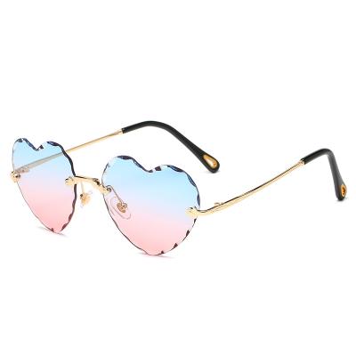 China Fashion Sunglasses Shape Design Metal Heart Shape Rimless Frame Trendy Sun Glass Women Where Sun Glasses Color Changing Sunglasses for sale