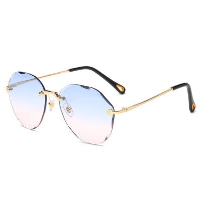 China Round Rimless Gradient Cut Glass-Metal Sunglasses Women Sun Shade Lens Sun Shades Retro Fashion Sun Glasses for sale