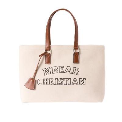 China 2022 China Unique White Tote Bag Logo Laptop Bag Famous Luxury Handbags for sale