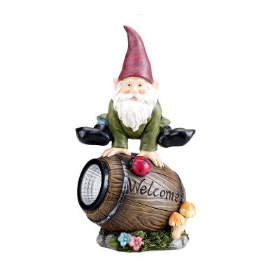 China Europe Resin Gnome Figurine Welcome Sign Jumping Over A Barrel With Solar Ladybug Lights Gnomes Garden Statue for sale