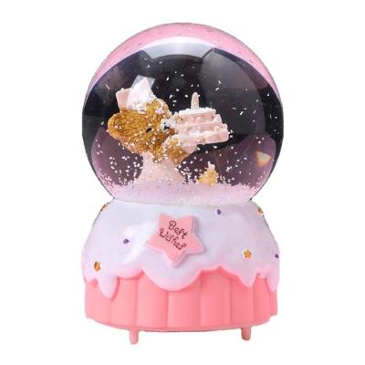 China Custom Wholesale Music Snow Globe Europe Birthday Kids Birthday Gifts Back Water Globe for sale